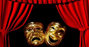 uma máscara alegre e outra feliz ante um fundo preto rodeado por cortinas vermelha de um palco